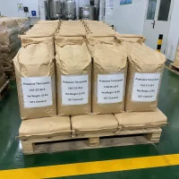 potassium-thiocyanate-kscn-25kg-paper-bag-pallet-warehouse Multiple brown paper bags (Net Weight: 25 KG each) of Potassium Thiocyanate (KSCN, CAS 333-20-0) stacked on wooden pallet in warehouse, all labeled UET Chemical, bulk packaging for chemical synthesis or textile processing applications