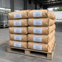 rubber-accelerator-tbbs-ns-cas-95-31-8-25kg-paper-bag-pallet Stacked 25kg brown kraft paper bags of Rubber Accelerator TBBS (NS) CAS 95-31-8 on a wooden pallet, ready for shipment in a warehouse.