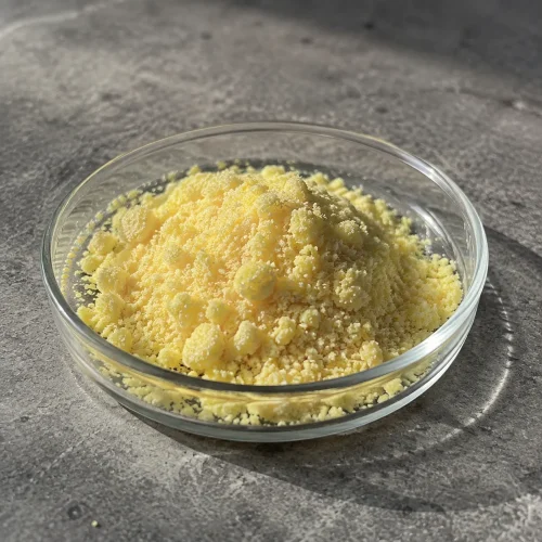 sodium-6-hydroxy-2-naphthalenesulfonate-cas-135-76-2-powder-sample Sodium 6-Hydroxy-2-Naphthalenesulfonate CAS 135-76-2 pale yellow powder sample displayed in a glass dish for chemical material identification