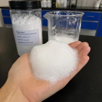 sodium-lauroyl-methyl-isethionate-cas-928663-45-0-rich-foam-mild-surfactant Hand holding dense, rich white foam generated from Sodium Lauroyl Methyl Isethionate CAS 928663-45-0, demonstrating its superior foaming properties as a mild surfactant for facial cleansers.