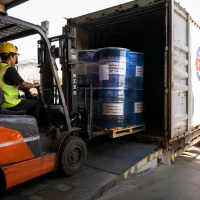 sodium-lauryl-sulfosuccinate-cas-71963-18-3-container-loading-export Forklift loading shrink-wrapped blue drums of Sodium Lauryl Sulfosuccinate (CAS 71963-18-3) into a container for export shipment
