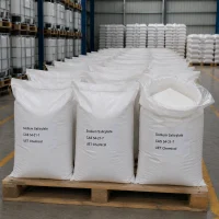 sodium-salicylate-bulk-white-woven-bag-warehouse-stock Rows of large white woven bags filled with white powder Sodium Salicylate (CAS 54-21-7) on wooden pallets in industrial warehouse, one bag open showing the contents, labeled UET Chemical, bulk supply for pharmaceutical and food applications