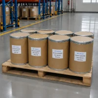 succinic-anhydride-25kg-cardboard-drum-pallet-stock Multiple 25 kg cardboard drums of Succinic Anhydride (CAS 108-30-5) stacked on wooden pallets in warehouse, labeled UET Chemical, bulk packaging ready for industrial distribution and chemical synthesis applications