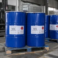 tbpb-cas-614-45-9-blue-steel-drums-bulk-packaging Blue steel drums containing TBPB CAS 614-45-9 with hazard warning labels stacked on a wooden pallet.