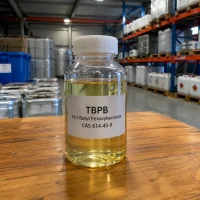 tbpb-tert-butyl-peroxybenzoate-cas-614-45-9-liquid-sample Sample bottle of yellowish liquid Tert-Butyl peroxybenzoate (TBPB) CAS 614-45-9 on a wooden table in a chemical warehouse.