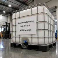 tetraethylene-pentamine-cas-112-57-2-white-ibc-tote-tank White IBC tote tank (1000L) containing Tetraethylene Pentamine CAS 112-57-2 with metal cage and valve, labeled UET Chemical, situated in a warehouse with a forklift nearby.