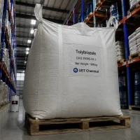 tolyltriazole-tta-cas-29385-43-1-1000kg-ton-bag-warehouse A 1000kg white ton bag of Tolyltriazole (TTA) CAS 29385-43-1 on wooden pallet, labeled UET Chemical, in a warehouse with high shelving units.