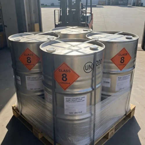 trifluoromethanesulfonic-acid-cas-1493-13-6-class-8-corrosive-metal-drums-pallet-forklift Pallet of metal drums containing Trifluoromethanesulfonic Acid CAS 1493-13-6, clearly labeled with Class 8 Corrosive hazard diamonds and UN markings, ready for shipment with a forklift in the background.