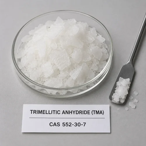 White crystalline Trimellitic Anhydride (TMA) CAS 552-30-7 flakes in glass dish with stainless spatula and label card
