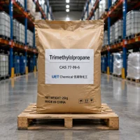 trimethylolpropane-tmp-cas-77-99-6-25kg-paper-bag-on-pallet A 25kg brown paper bag of Trimethylolpropane TMP CAS 77-99-6 on a wooden pallet in a warehouse, labeled with UET Chemical branding and 'MADE IN CHINA' mark.
