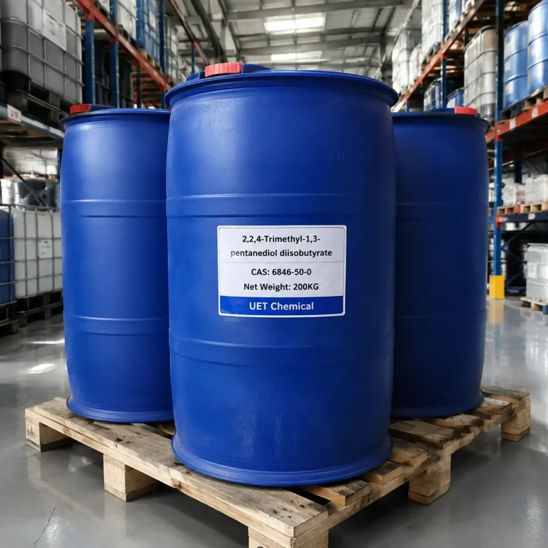 txib-200kg-blue-plastic-drum-warehouse-pallet Three 200kg blue plastic drums of TXIB (2,2,4-Trimethyl-1,3-pentanediol diisobutyrate, CAS 6846-50-0) on wooden pallet in warehouse, labeled UET Chemical, industrial bulk packaging