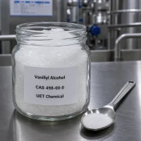 vanillyl-alcohol-cas-498-00-0-white-crystal-sample-uetchmical Glass jar containing white crystalline Vanillyl Alcohol CAS 498-00-0 with a metal spoon, displaying high purity for laboratory testing and flavor applications by UET Chemical.
