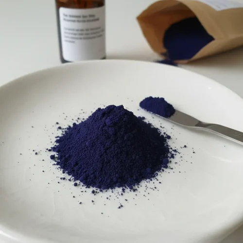 Close-up macro shot of deep navy blue Vat Blue 18 (Navy Blue BR) CAS 1324-54-5 powder on a white ceramic plate, showcasing its fine, uniform texture and intense coloring strength ideal for cotton and cellulosic fiber dyeing.