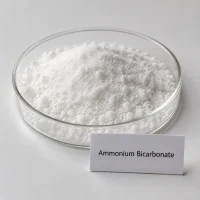 white-crystalline-ammonium-bicarbonate-powder-cas-1066-33-7 White crystalline ammonium bicarbonate (ammonium hydrogen carbonate) powder CAS 1066-33-7 in glass dish with label card