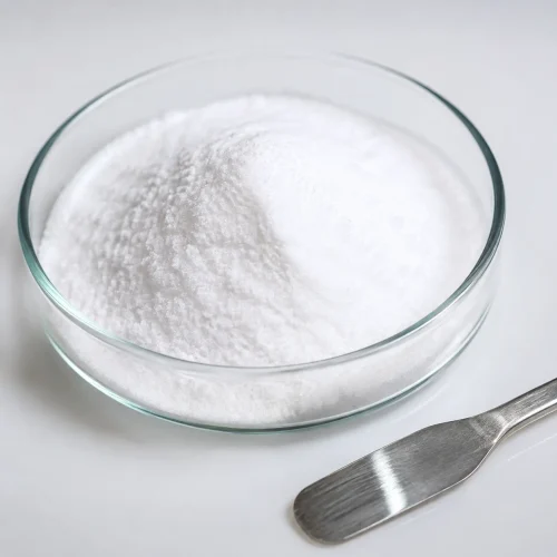White crystalline GABA gamma-aminobutyric acid powder CAS 56-12-2, 99% purity, shown in glass laboratory dish