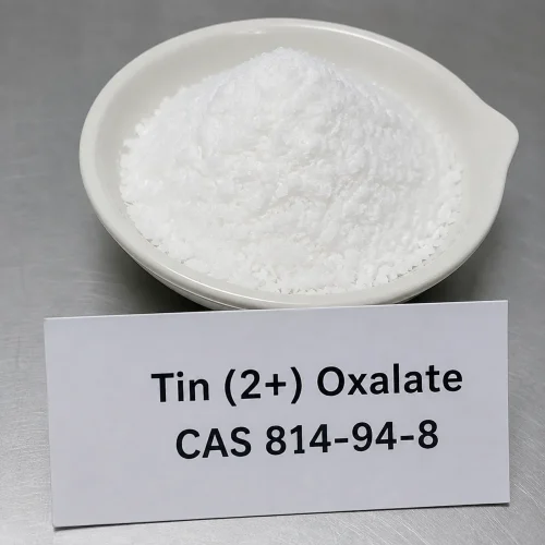 White crystalline stannous oxalate tin(II) oxalate powder CAS 814-94-8 in ceramic dish with product label card